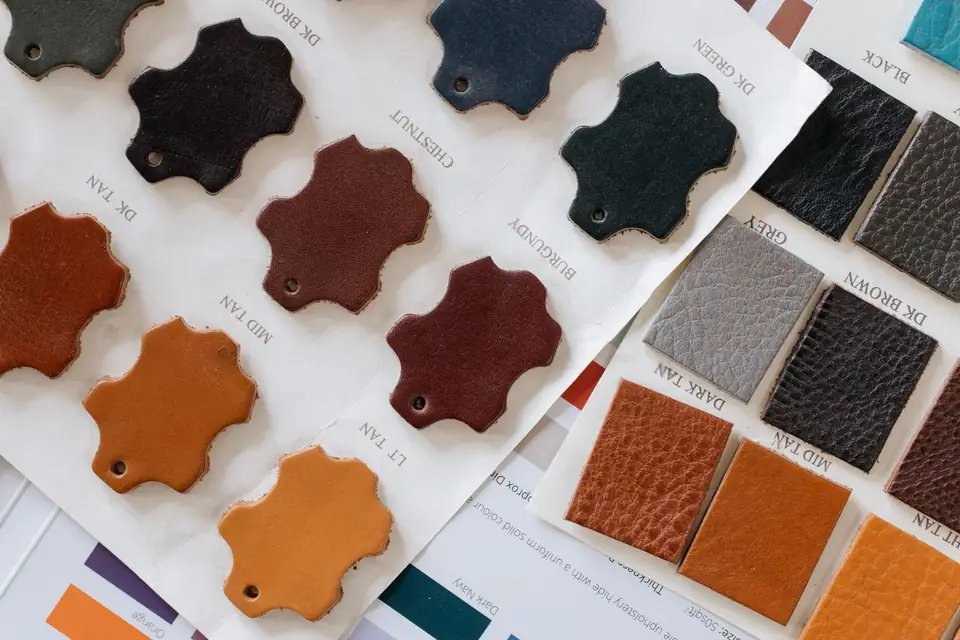 Leather swatch card showing different colours and textures.