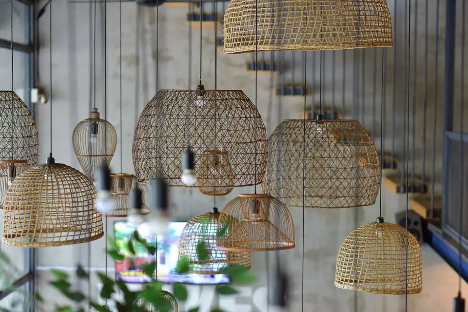 Woven rattan pendant lights hanging in a café.