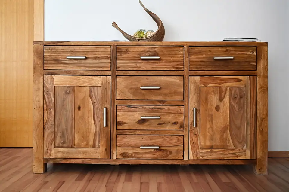 Solid wood sideboard with drawers and doors.