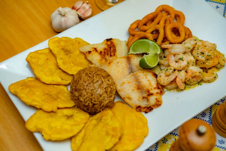 Mixed platter: fried plantains, grilled fish, prawns, squid rings and rice.