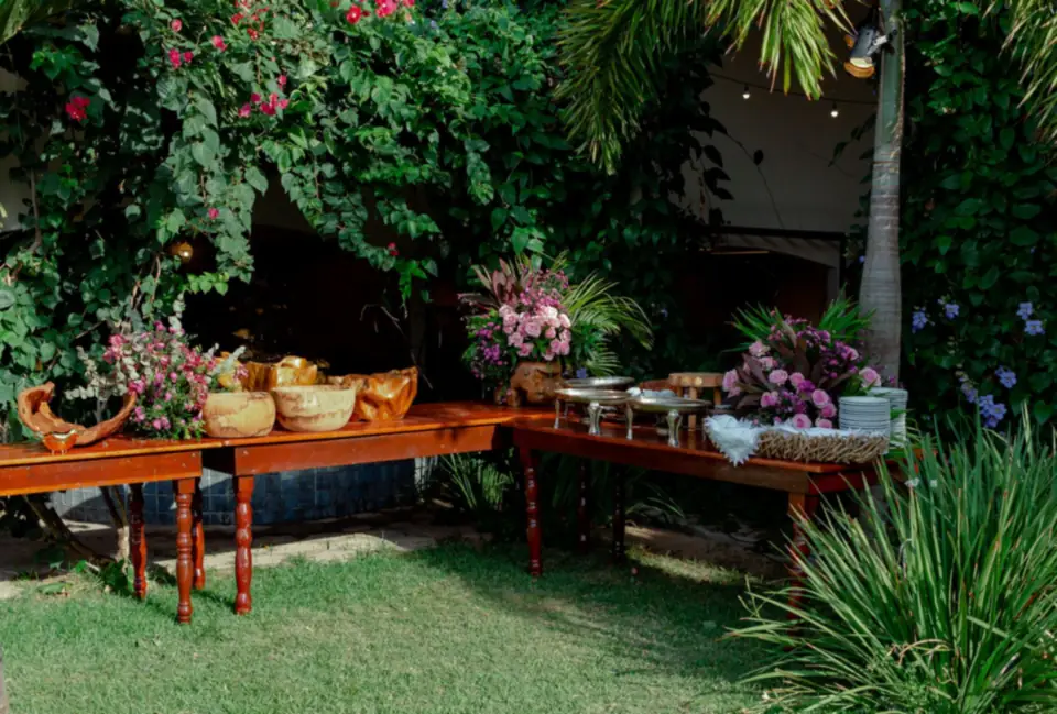 Buffet set up outdoors in a flowering garden.